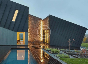 In-ground pool design using brick with gazebo & outdoor furniture setting